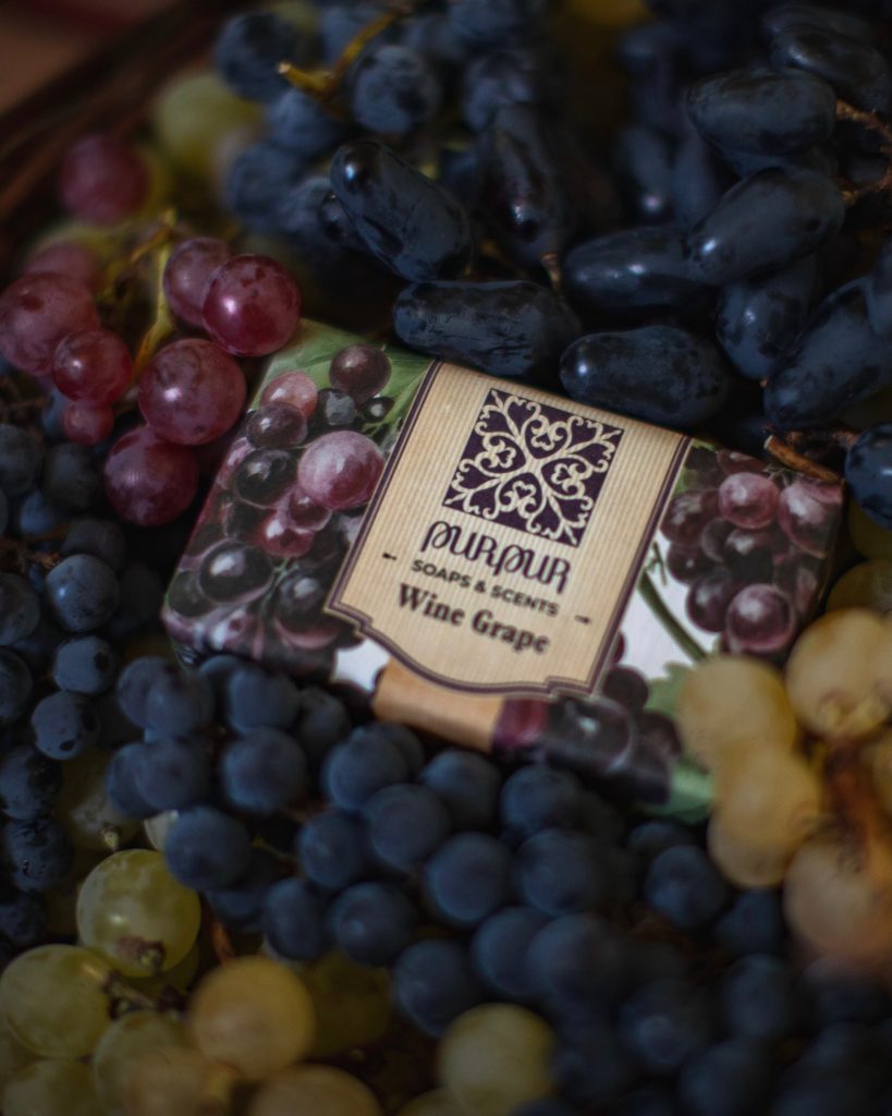 PurPur Wine Grape soap among dark and golden grapes